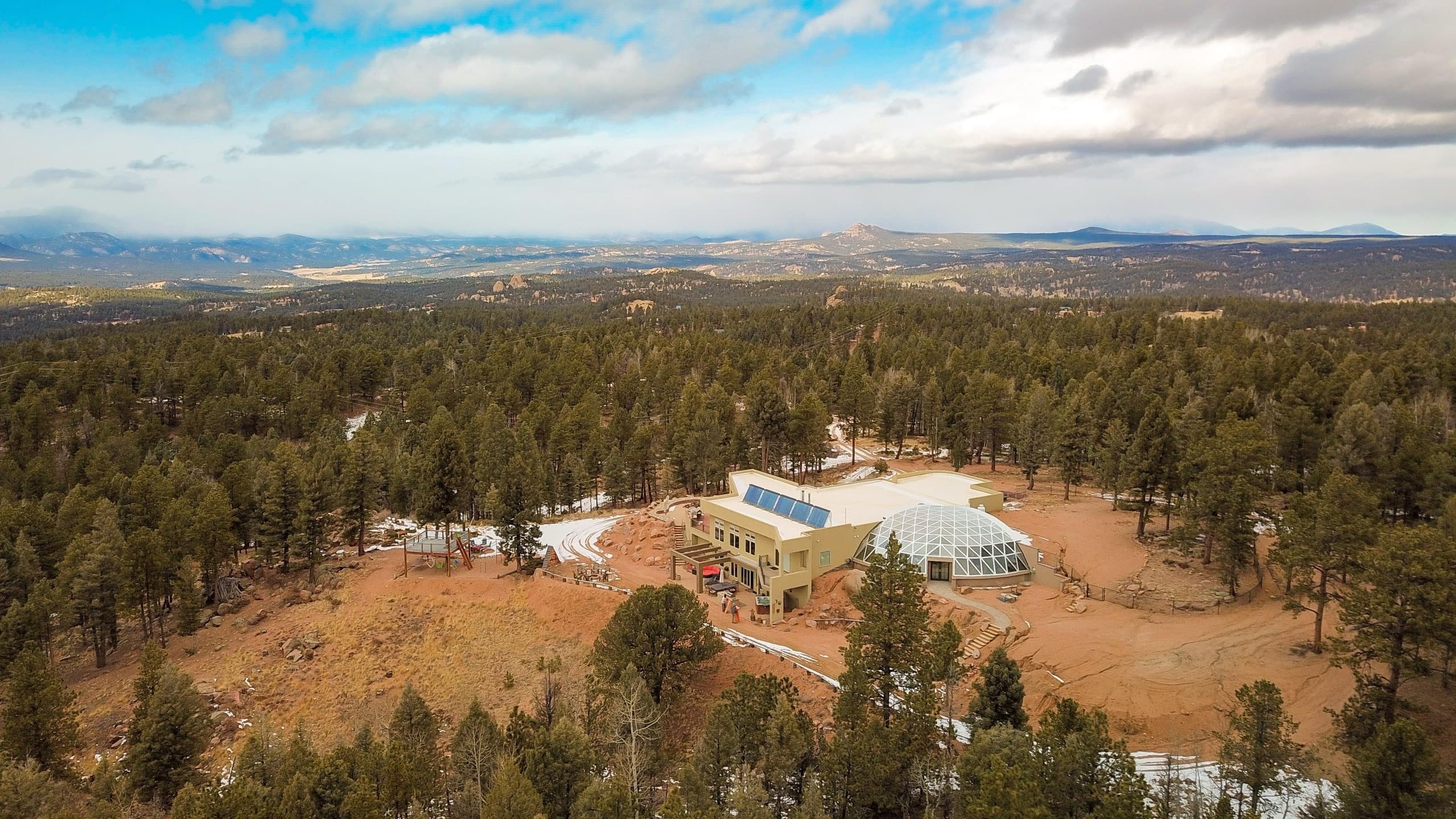 The lodge and grounds from above at the top of the ridge